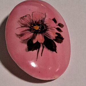 pink large oval brooch with a rose flower design